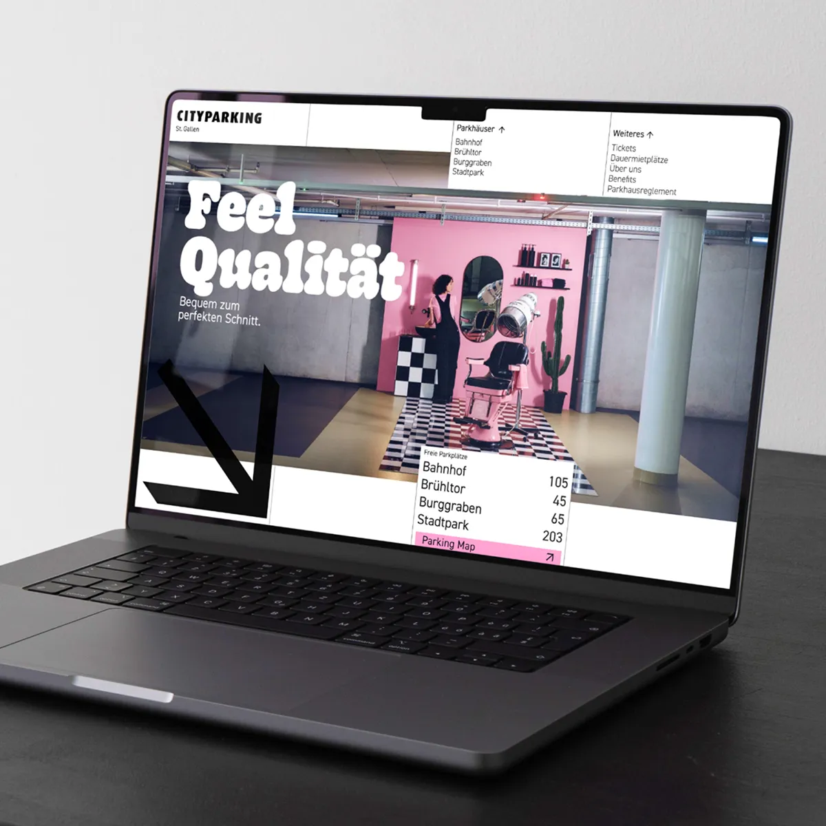 Modern laptop displaying a website for CityParking St.Gallen with a vintage-style hair salon photo and parking availability info.